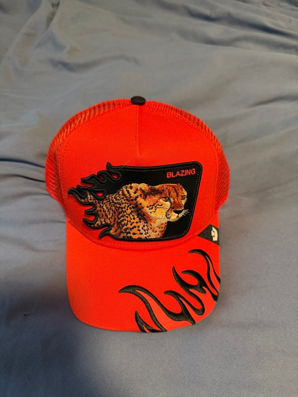 Unisex Red Trucker Hat with Blazing Cheetah Patch